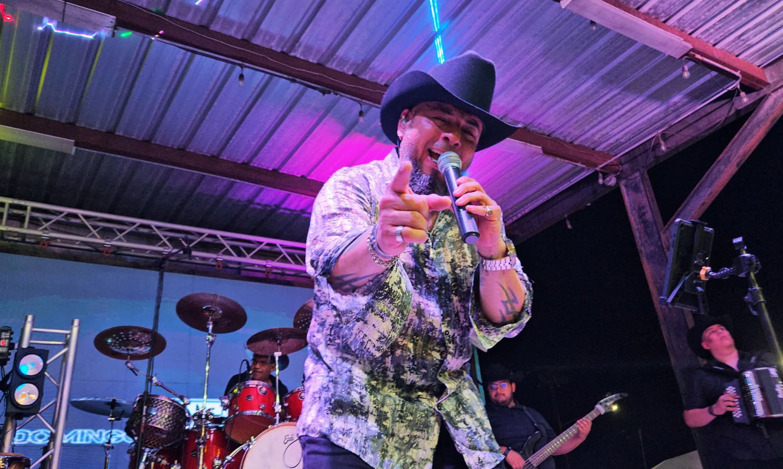 3Zero performing live on stage, pointing at the crowd